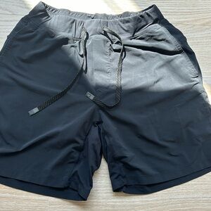 Men’s black Fabletics shorts with liner